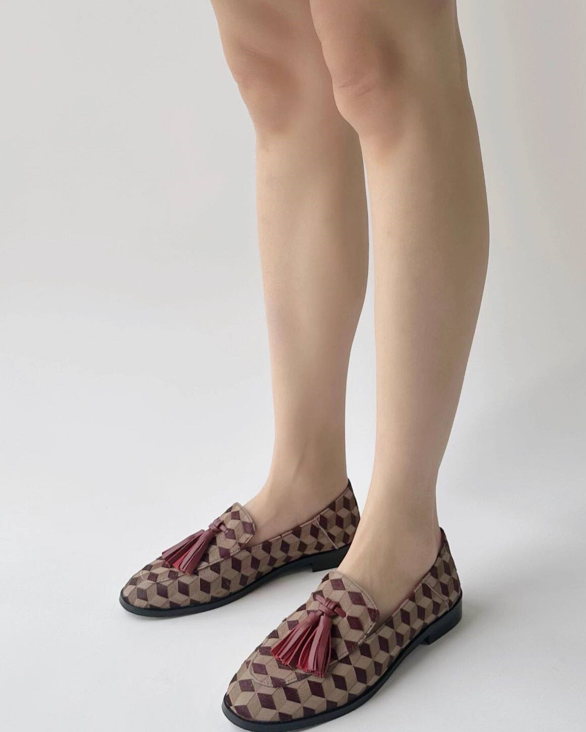 B-FEI British-style round toe loafers.