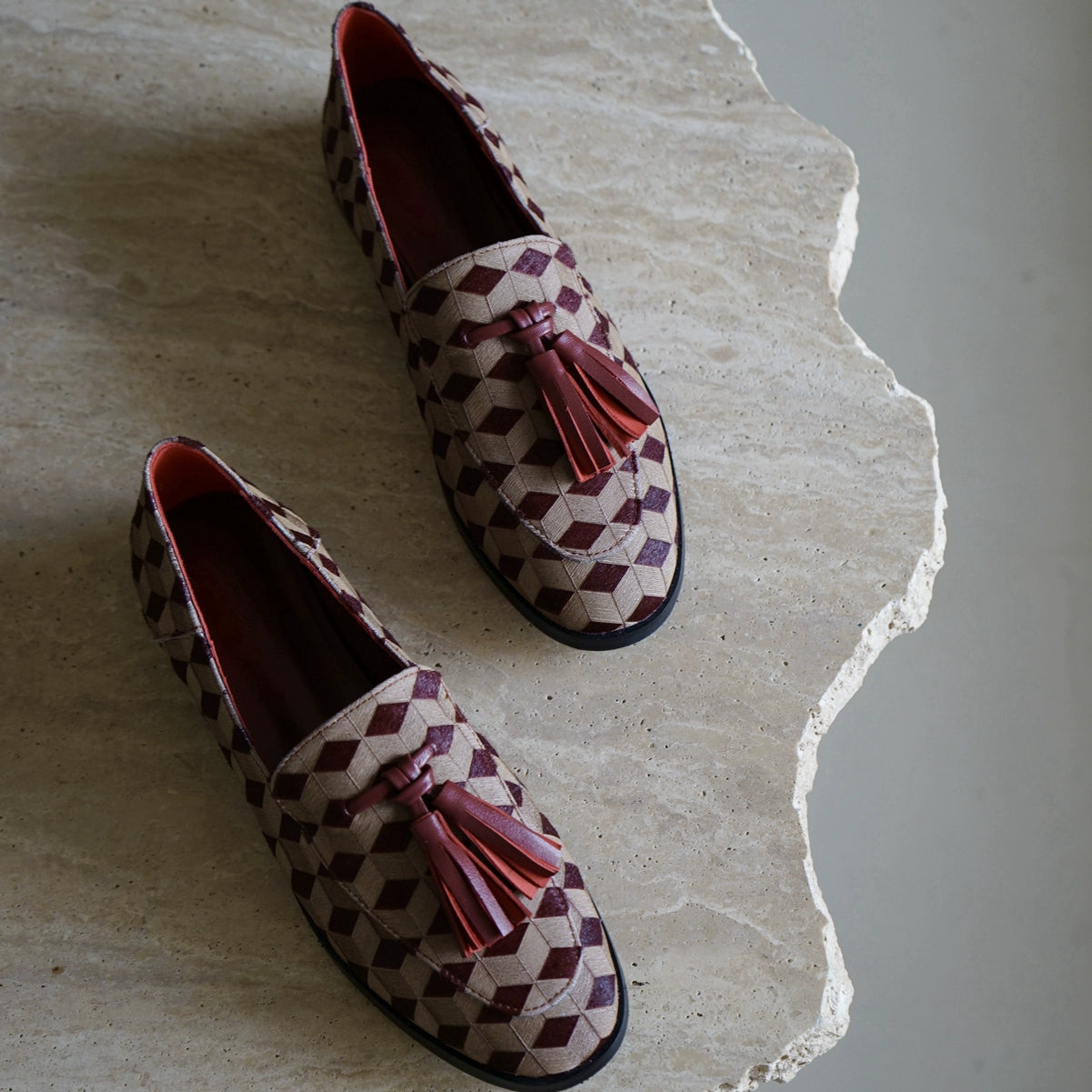 B-FEI British-style round toe loafers.