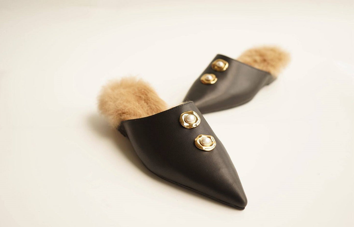 B-FEI black leather single shoe with metal buckle.
