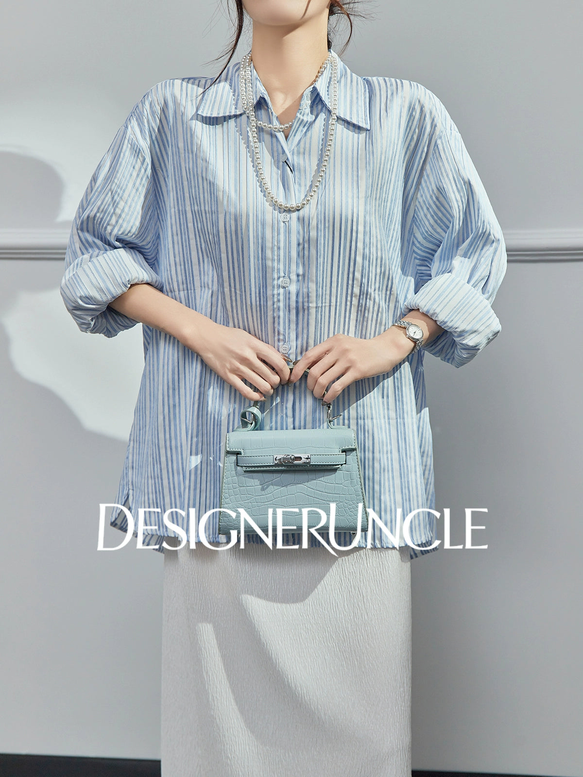 DGU| Blue Knitted Loose Vertical Light Luxury Commuter Fan Niche Design Top - George.