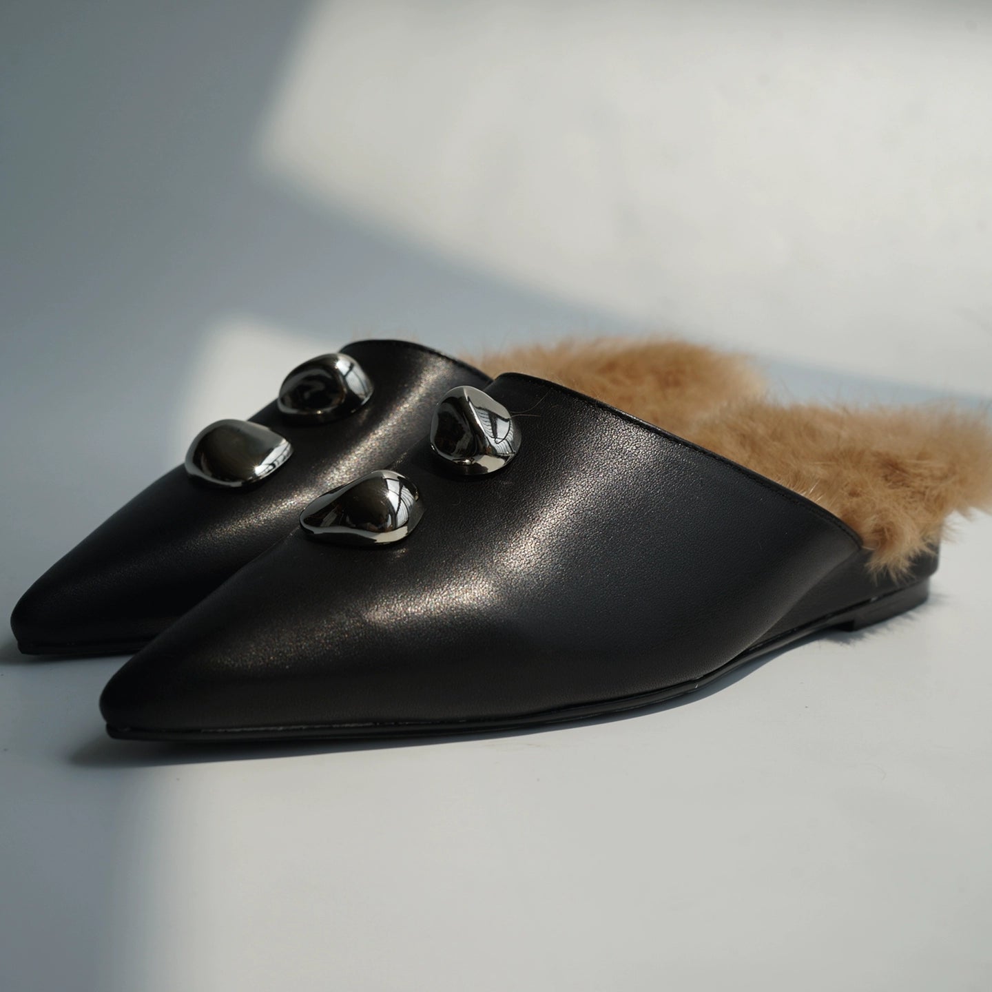 B-FEI black leather single shoe with metal buckle.