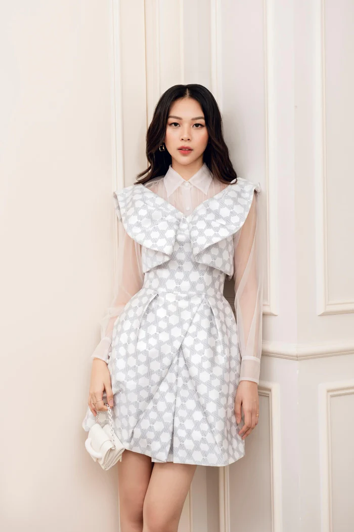 cross over mini dress Mini dress is crafted from taffeta, a wide V neck, crossover and draped skirt- Copa L
