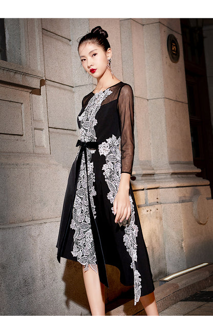 Black dress with its U-neck cut and elegant embroidery- Eva