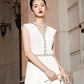 Elegant halter neck, this summer party dress is designed to display a deep V-Filomina