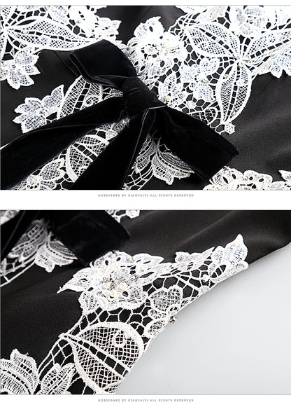 Black dress with its U-neck cut and elegant embroidery- Eva